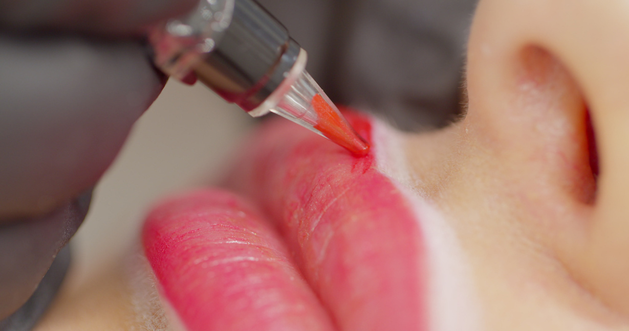 Cosmetologist Making Permanent Makeup on Woman's Face.