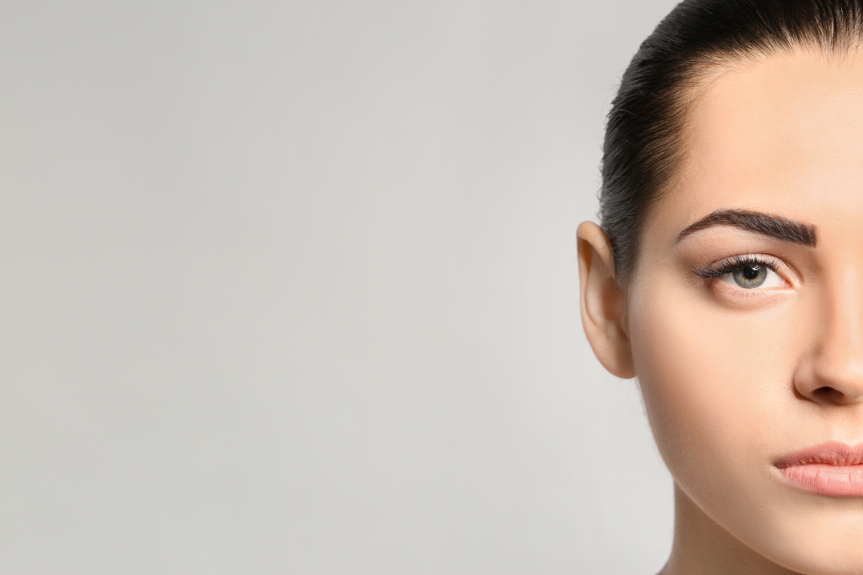 Young Woman with Permanent Eyebrows Makeup